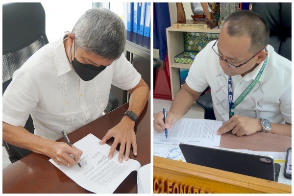 PPP Center Executive Director Ferdinand A. Pecson (left) and DENR-BMB Undersecretary for Special Concerns Edilberto DC. Leonardo sign the Memorandum of Agreement